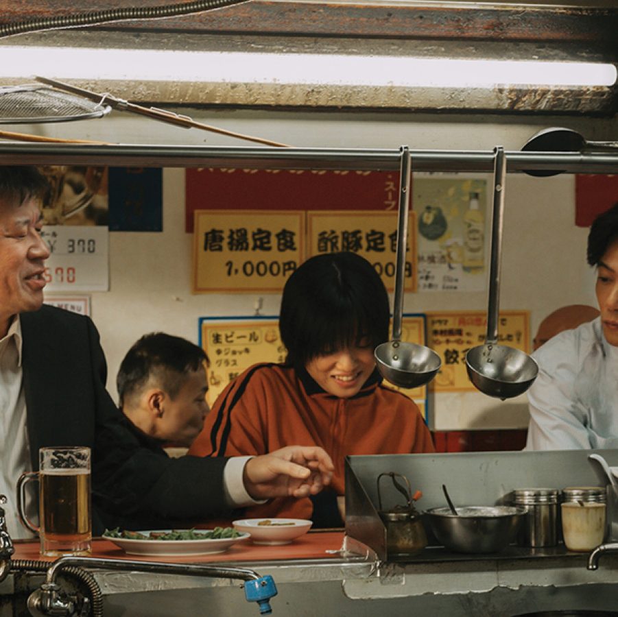 From left, detective Tamotsu Tatara (Jiro Sato), young woman Ann (Yuumi Kawai) and journalist Tatsuki Kirino (Goro Inagaki) sit at the counter of a local restaurant, in a scene from A Girl Named Ann.